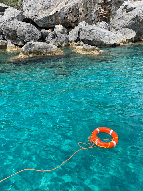 Lifebuoy floating on turquoise water