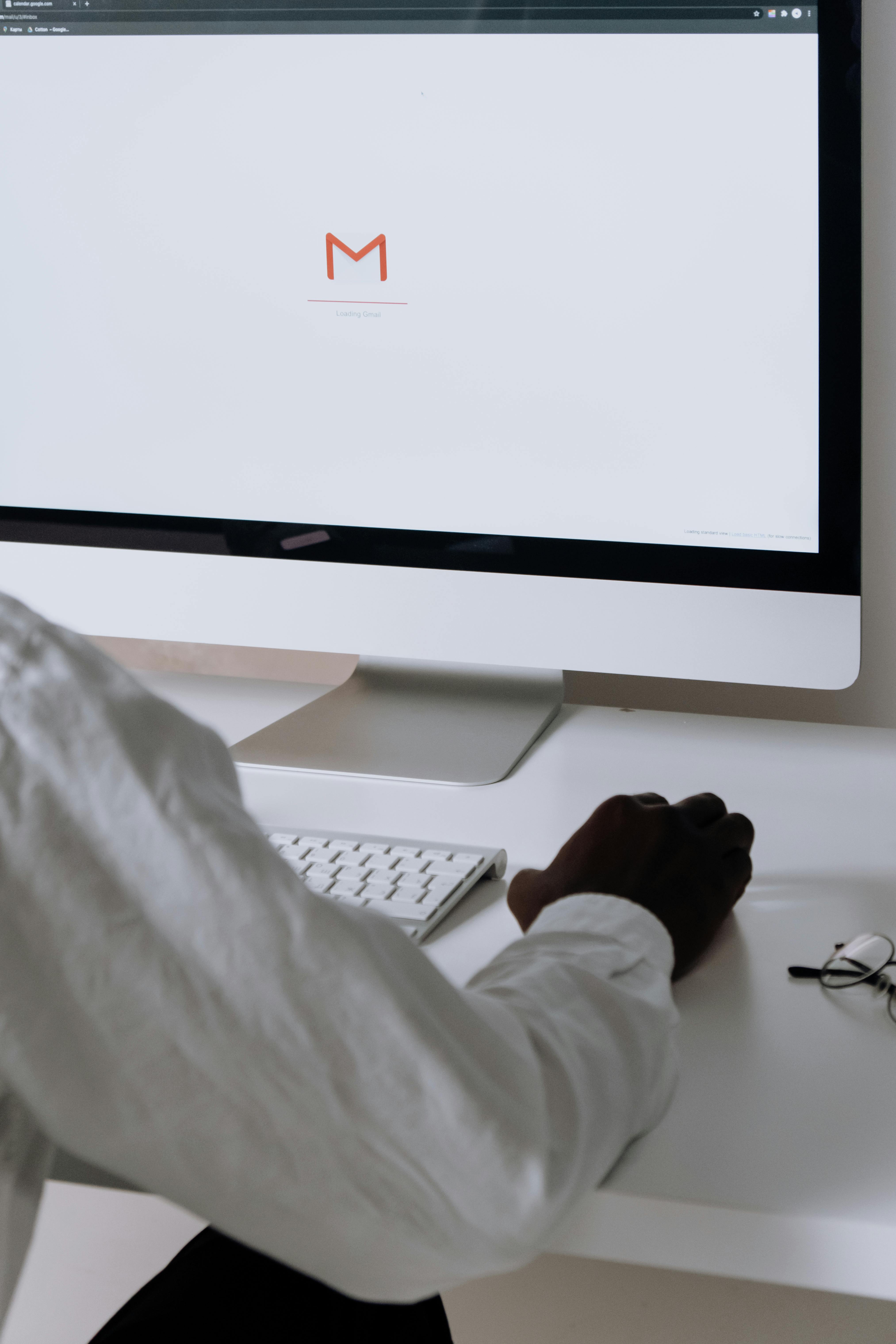 silver imac on white table