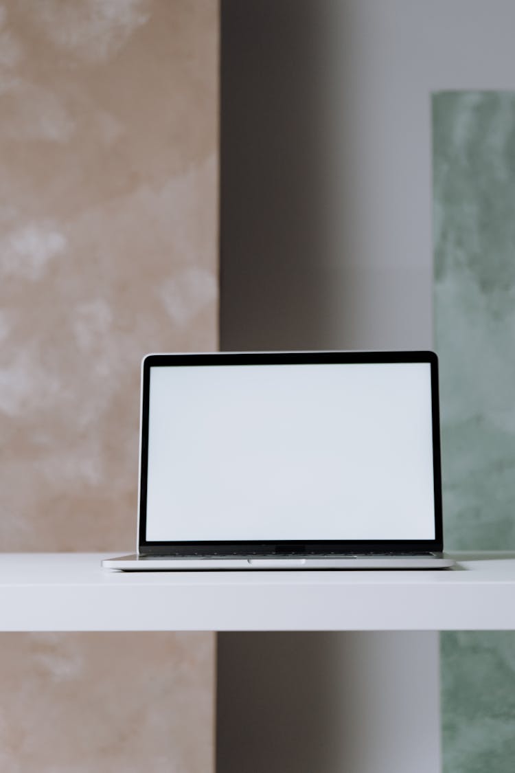 Black And White Laptop Computer On White Table