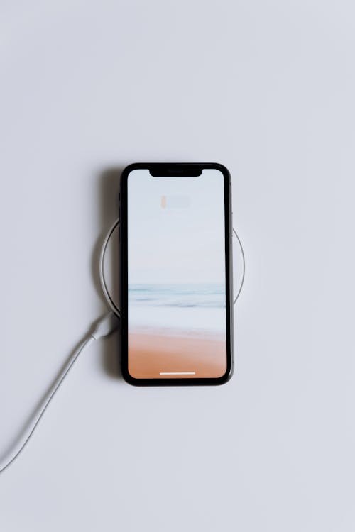 Free Black Android Smartphone on White Table Stock Photo