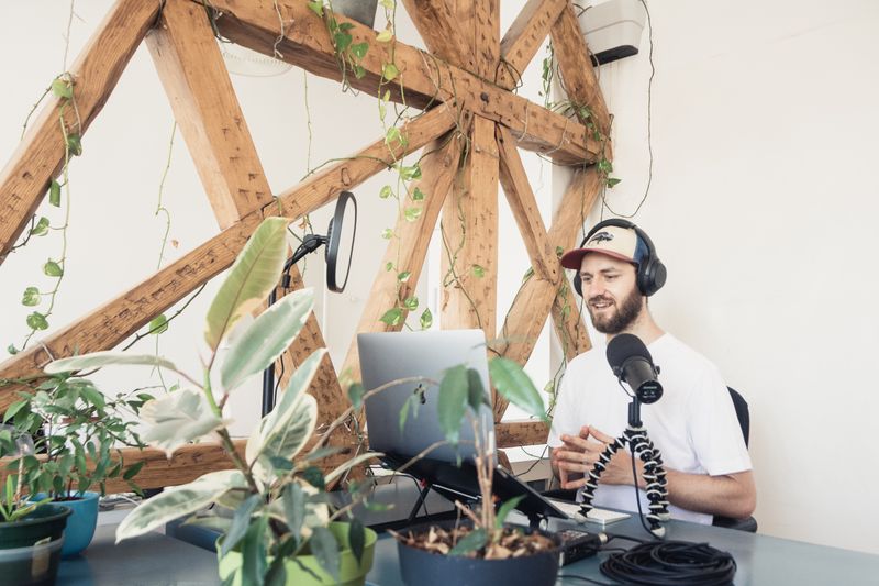 Content creator recording podcast as part of AI organic traffic strategy for multi-platform distribution
