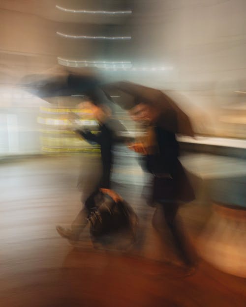 People with umbrellas on city street