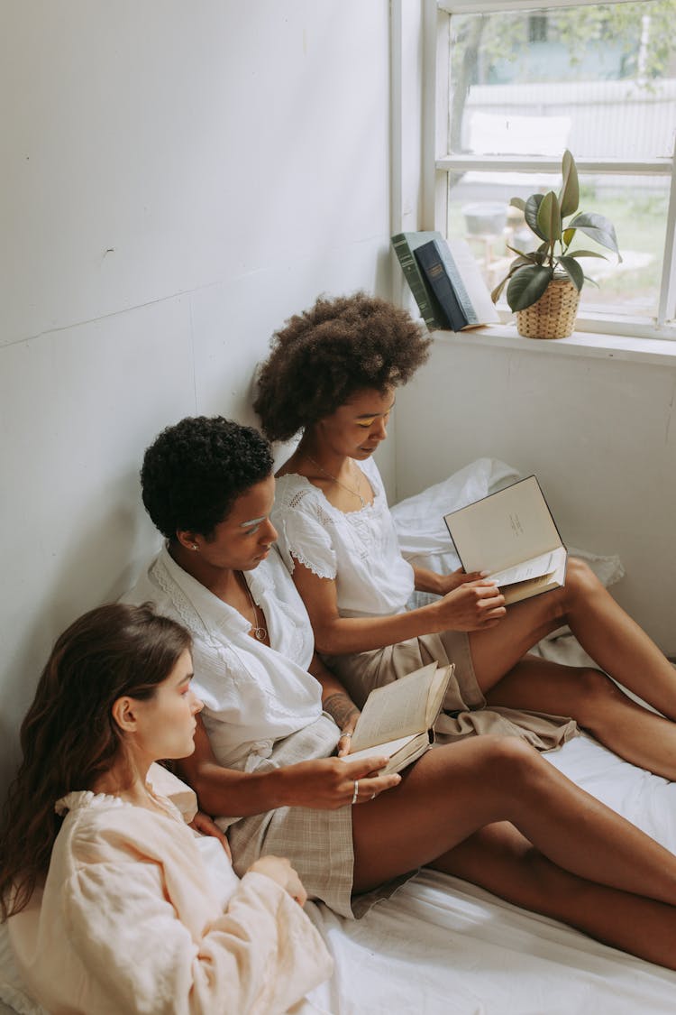 Women In Bed  Reading Books