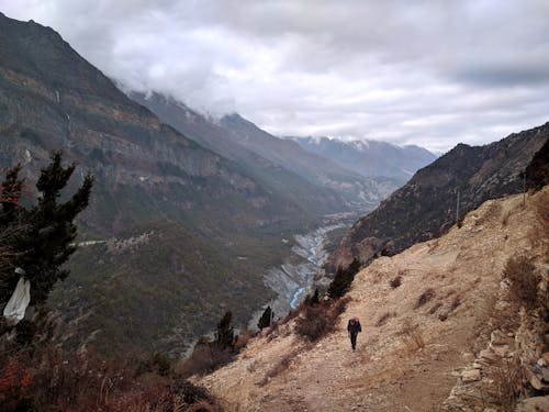 A Man Hiking on a Mountain