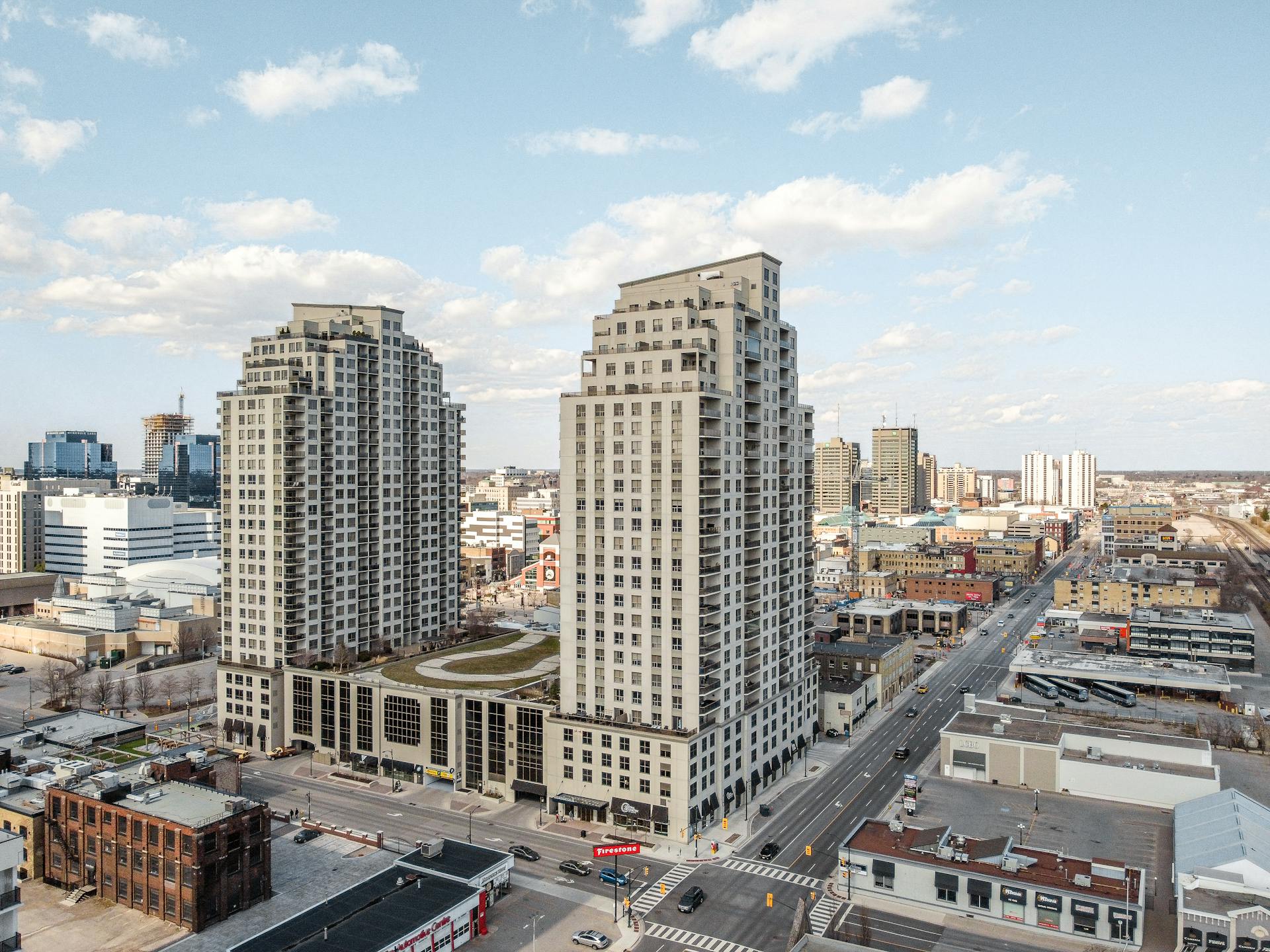 High-rise buildings in downtown London, Ontario under a clear sky.