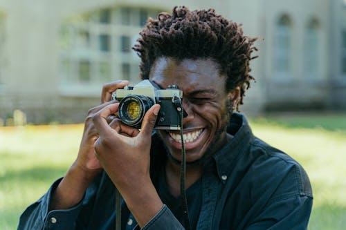 Man Taking Photo with a Camera