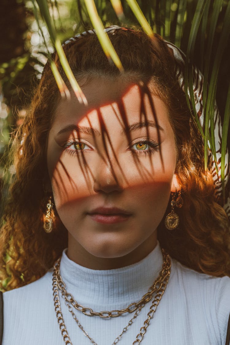 Face Of Woman In Shadow Of Palm