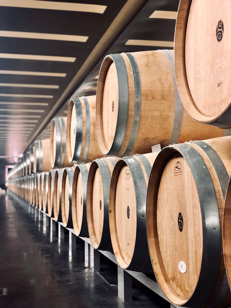 Stacked Of Brown Wooden Barrels 