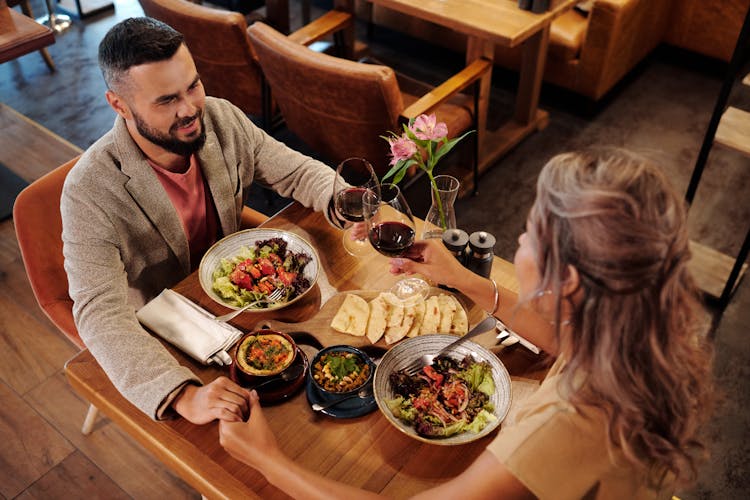 Couple Eating Dinner In A Restaurant 