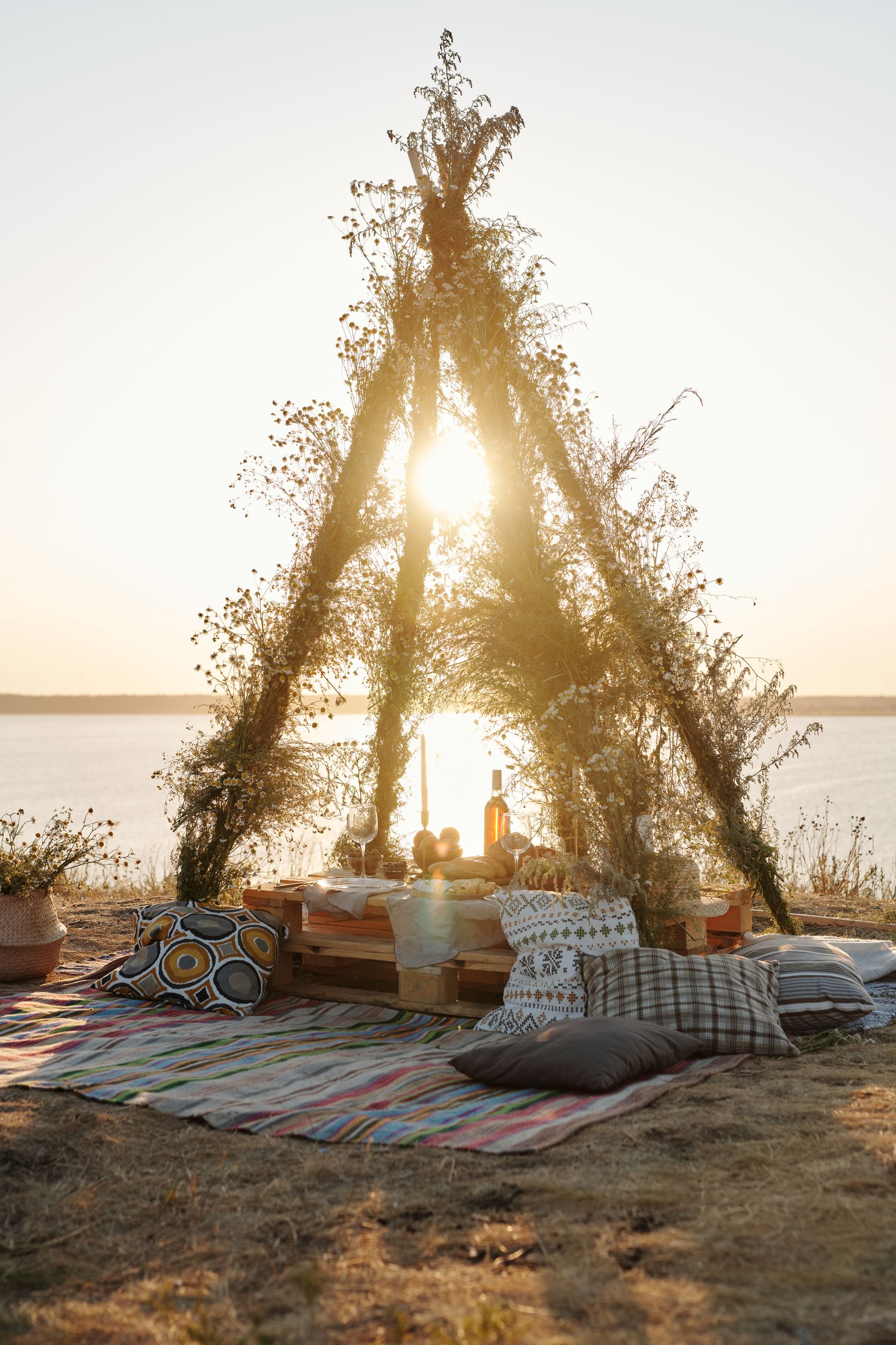 Spacious camping tent and outdoor living setup beside a natural landscape