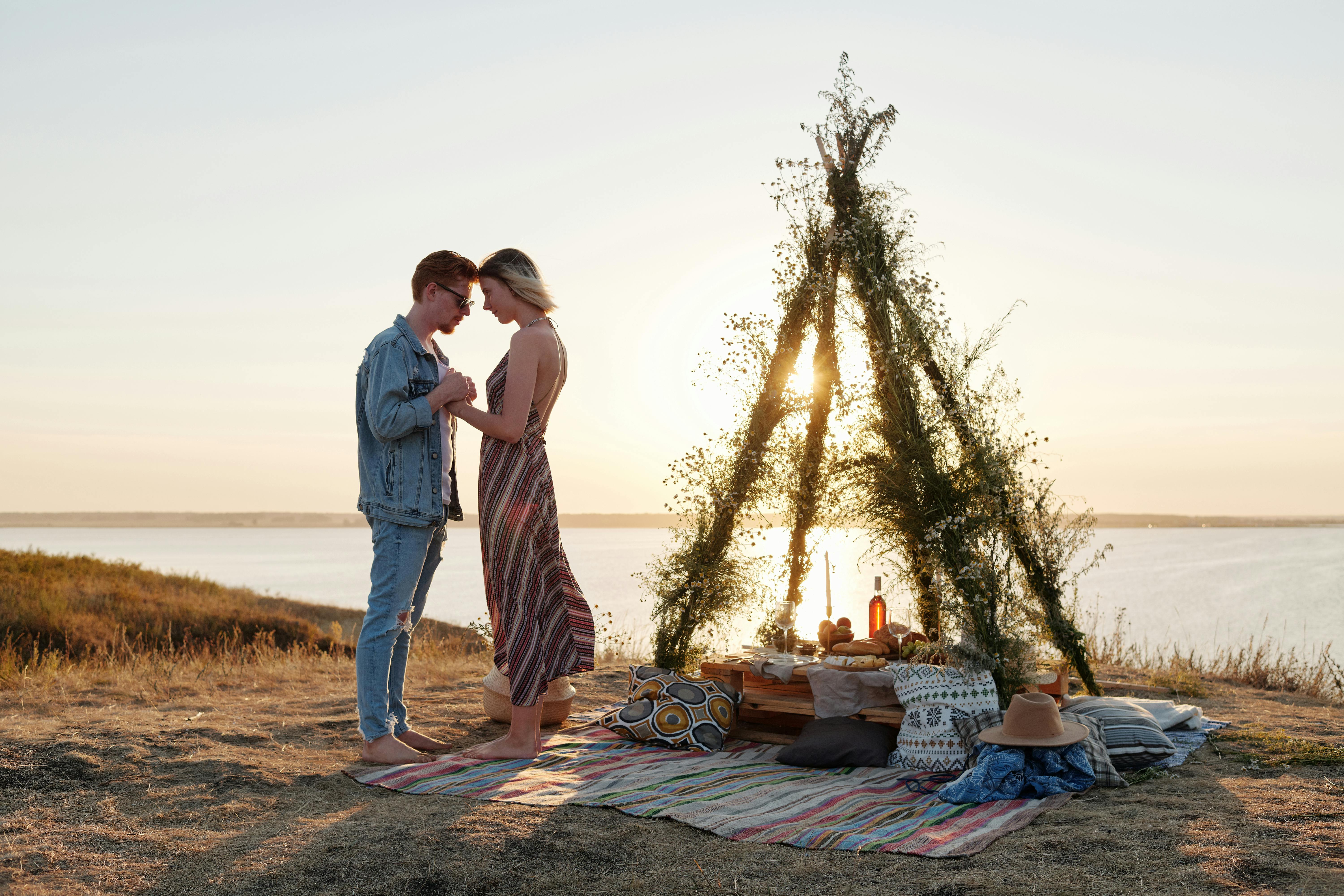 a couple having a romantic picnic date