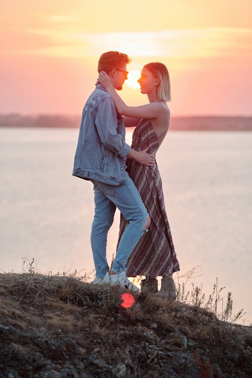 Free A Romantic Couple Looking at Each Other while Standing Stock Photo