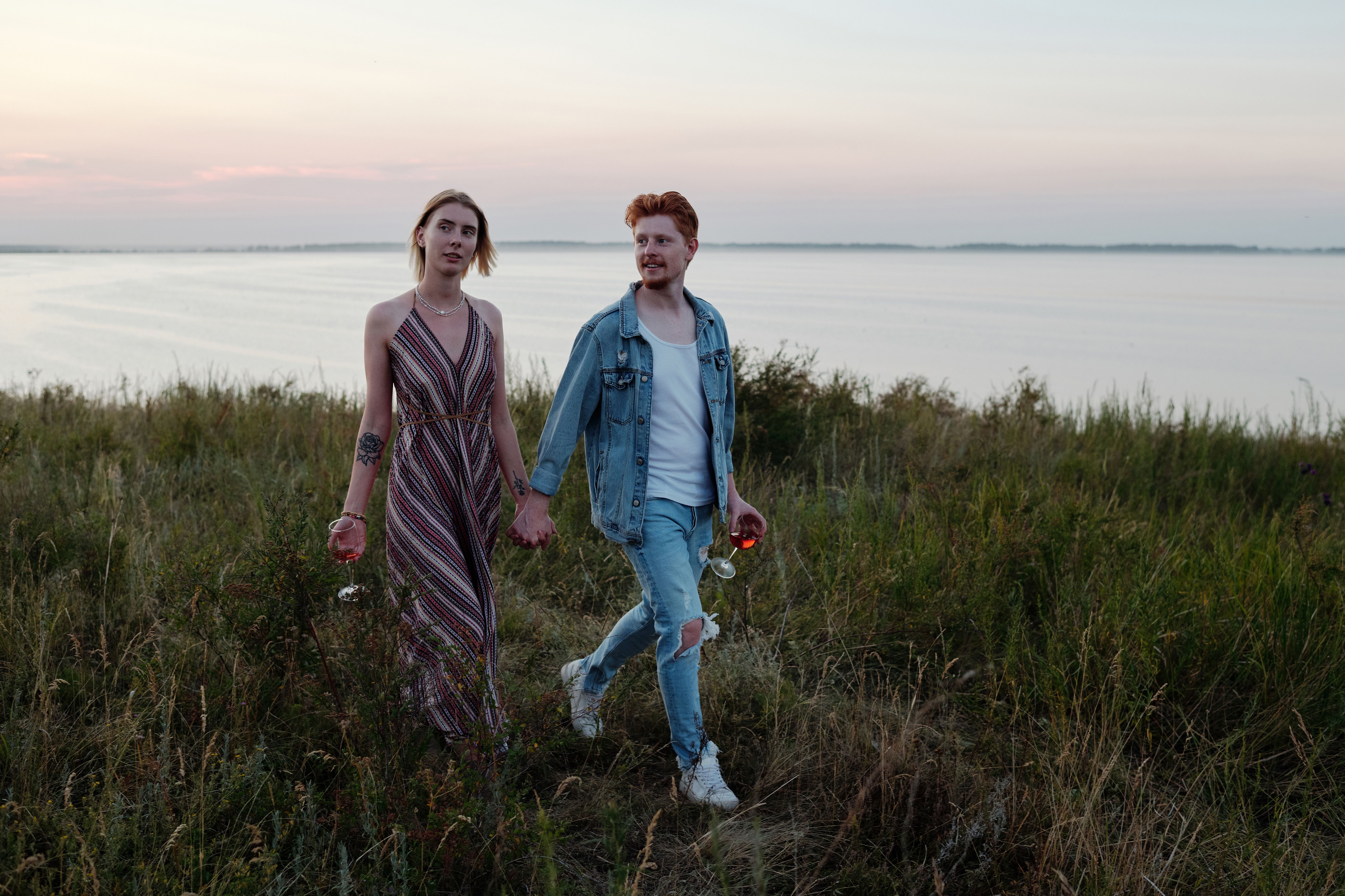 A Couple Holding Hands while Walking · Free Stock Photo