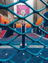 A Basketball Court Behind the Metal Fence