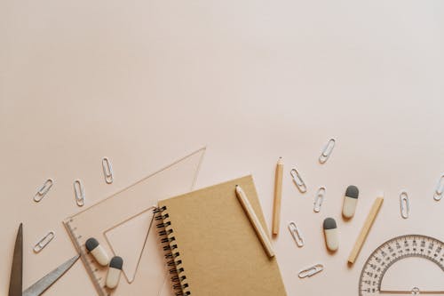 Spiral Notebook Pencils and Paper Clips Flatlay