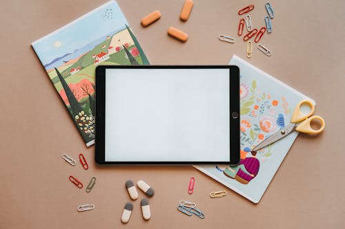 Free Ipad Paper Clips and Erasers Flatlay Stock Photo