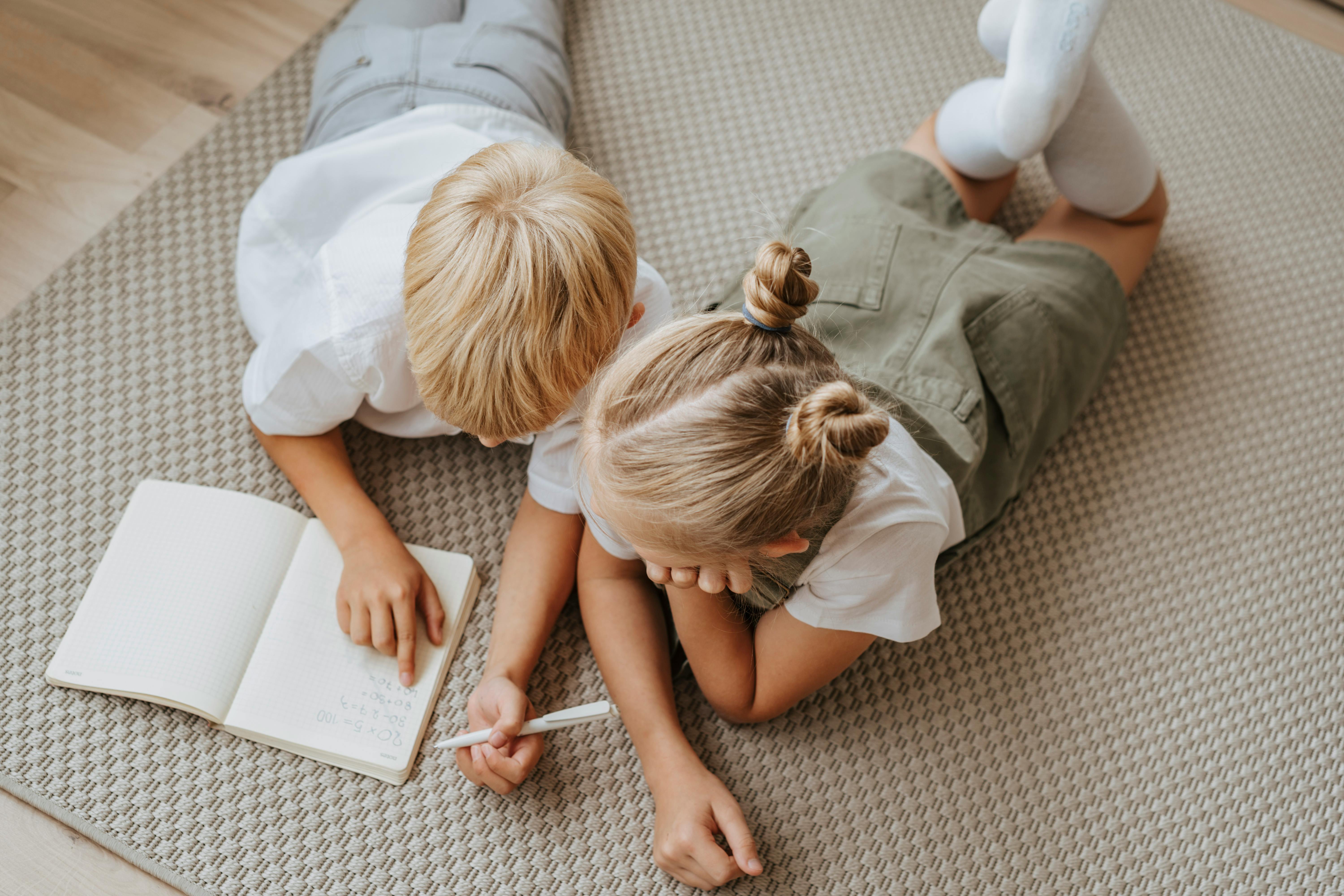 Focused students doing homework at home \u00b7 Free Stock Photo