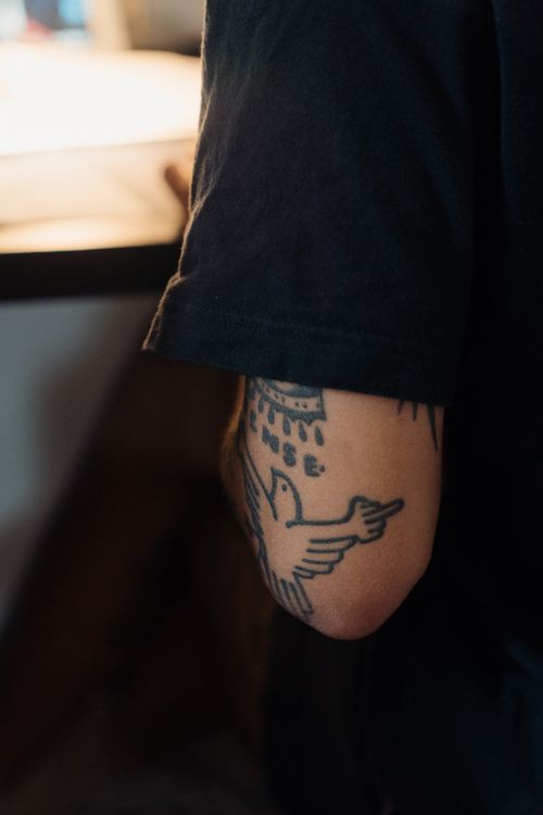 Free Detailed view of a tattoo featuring a bird design on a person's arm. Stock Photo
