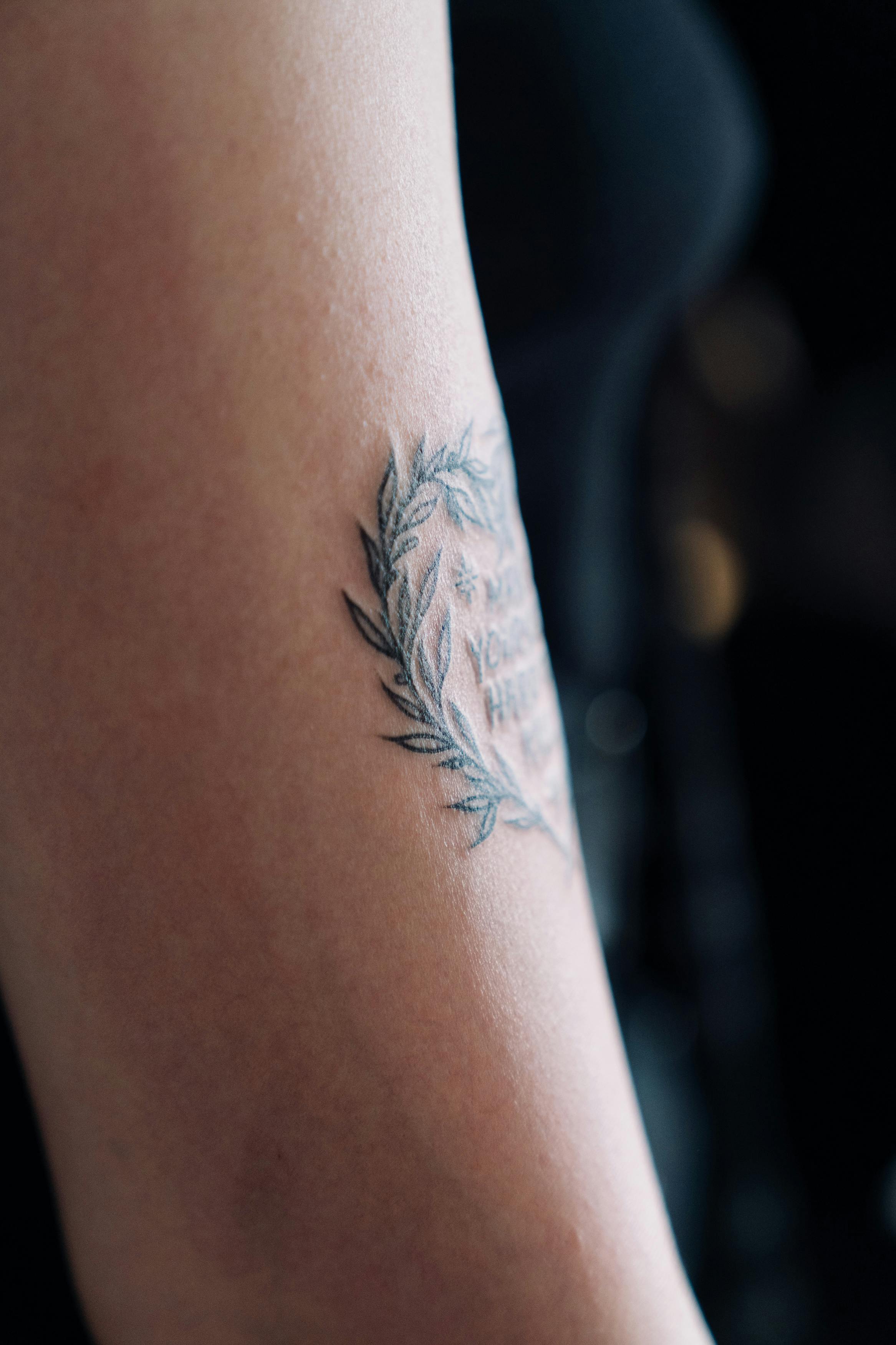 Premium Photo  Smooth and effortless cropped shot of an unrecognizable  womans tattooed legs in studio against a grey background