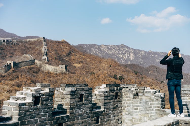 Back View Of A Person Standing On Great Wall Of China