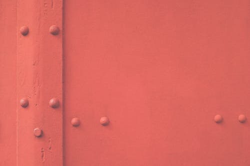 Close-Up Shot of a Red Metal Door