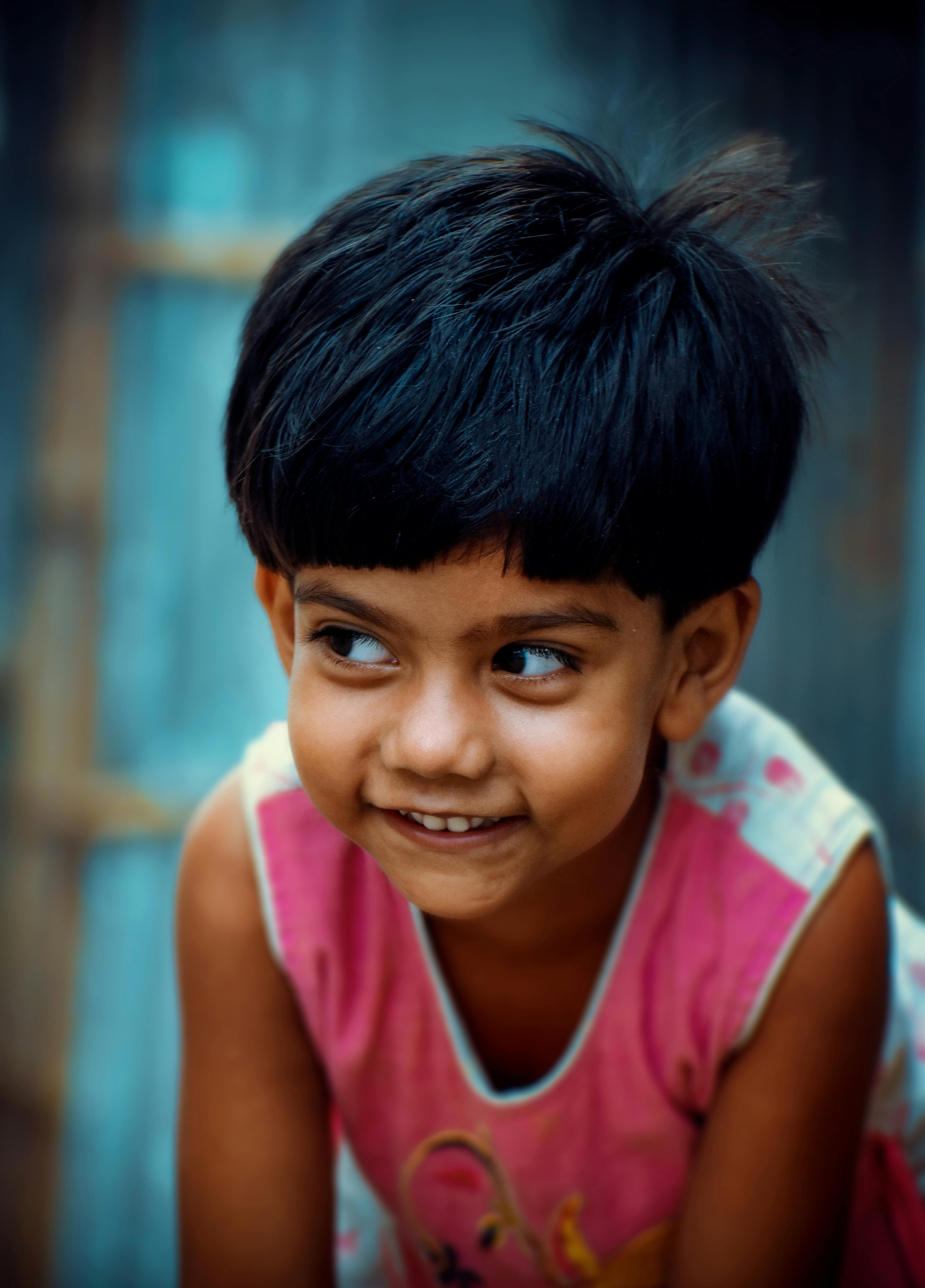 A Cute Little Boy Sitting on a Brown Field while Smiling at the Camera · Free Stock Photo A Cute Little Boy Sitting on a Brown Field while Smiling at the Camera · Free Stock Photo