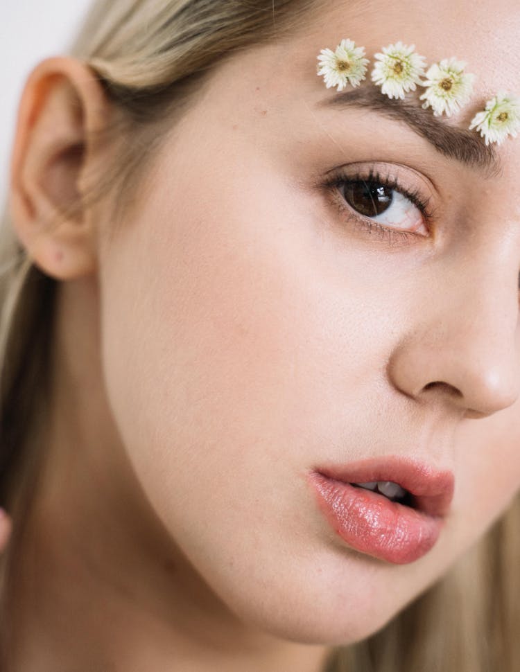 Small Flowers Over A Woman Eyebrow