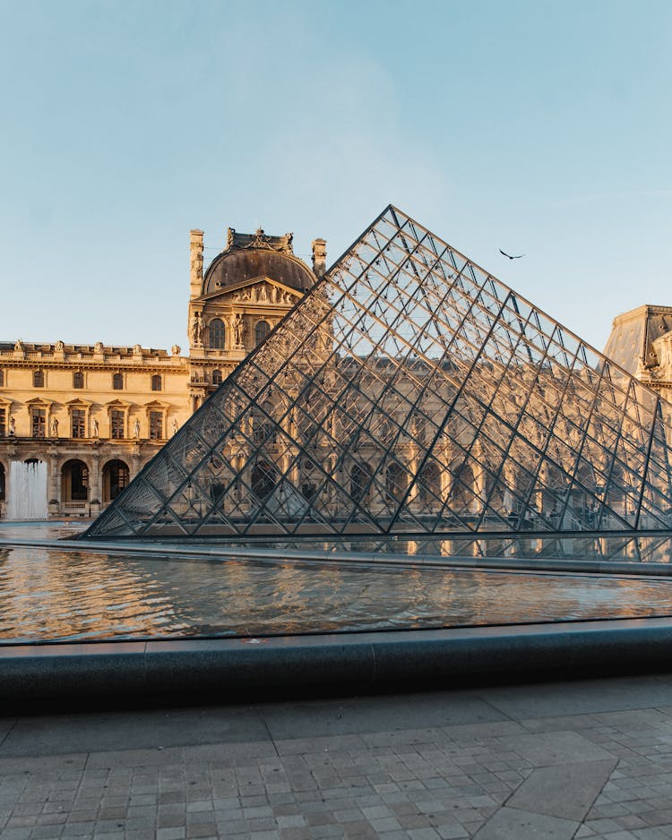 The Pyramid In Louvre Museum In Paris France