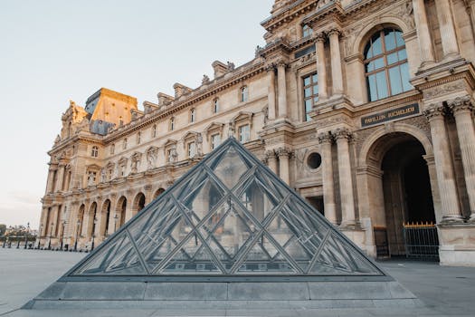 Iconic Louvre Museum with glass pyramid, a must-see in Paris.