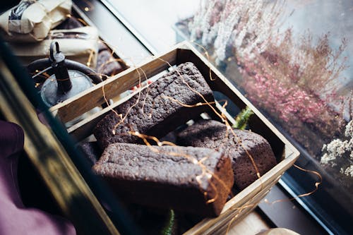 Free Loaves of Chocolate Bread on a Wooden Basket Stock Photo