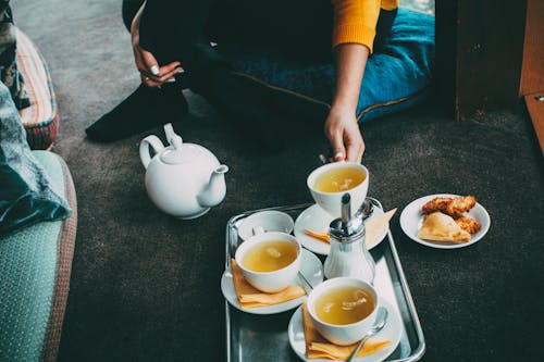 Free Person Holding a Cup of tea Stock Photo