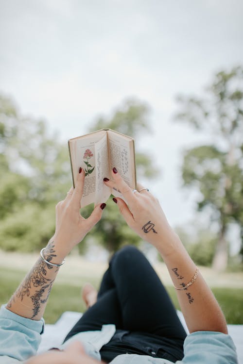 Free Woman Holding a Book Stock Photo