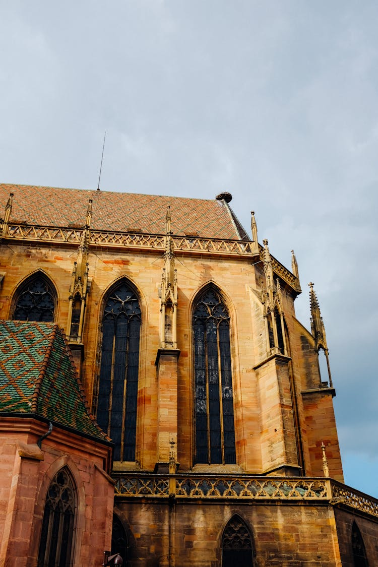 Facade Of Aged Church With Spires