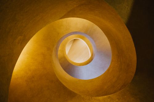 Free Top view of abstract background of spiral unusual element in dim yellow light Stock Photo