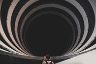 Man in Black Shorts and Black Shirt Standing on Tunnel
