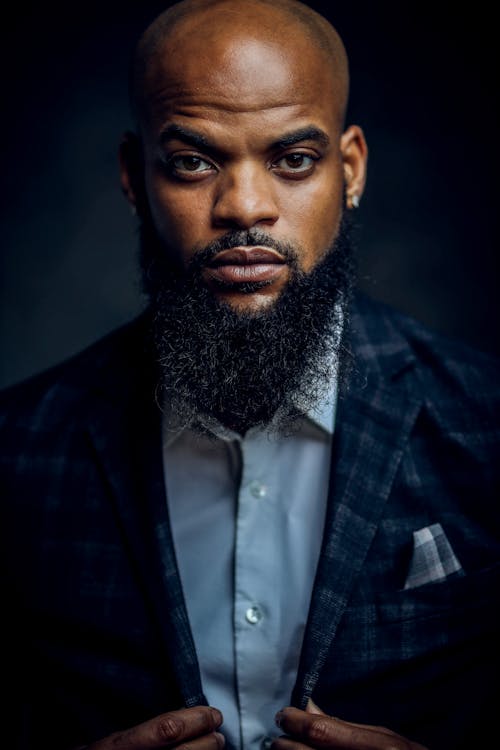 Portrait of a Handsome Man in a Suit Looking at the Camera