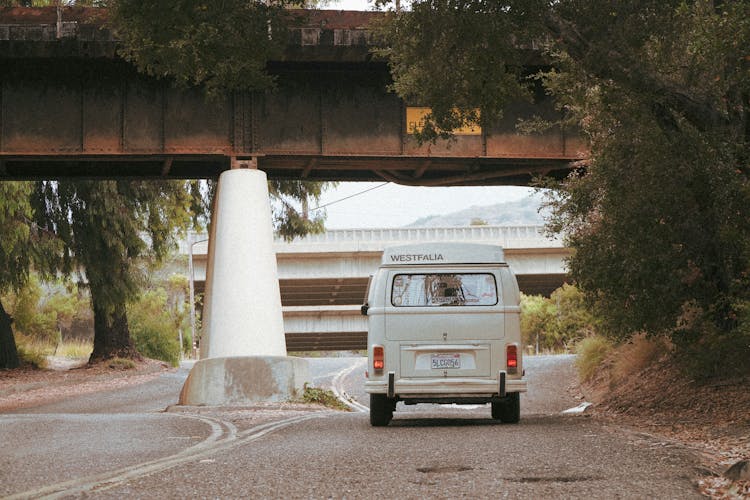 A Camper Van Traversing A Road