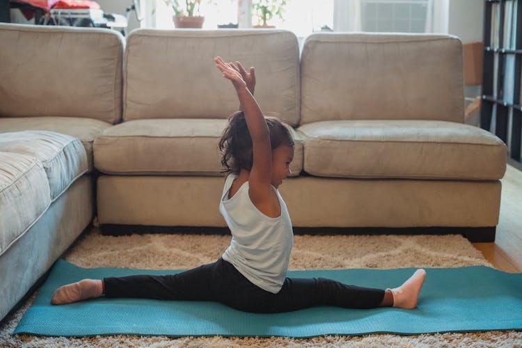 Cheerful Girl Doing Stretching At Home