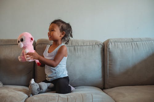 Young Girl holding a Stuff Toy 