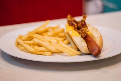 Bacon hot dog with fries by Anna Tarazevich on Pexels