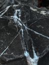 Piece of rough mineral rock with scratches