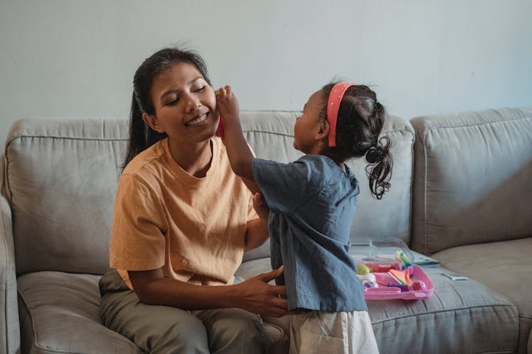 Asian Daughter Doing Examination Of Happy Mother While Playing Doctor