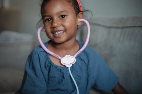 Cheerful Asian girl with stethoscope