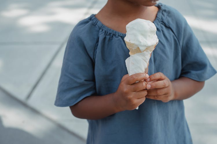 Child With Melting Ice Cream Cone