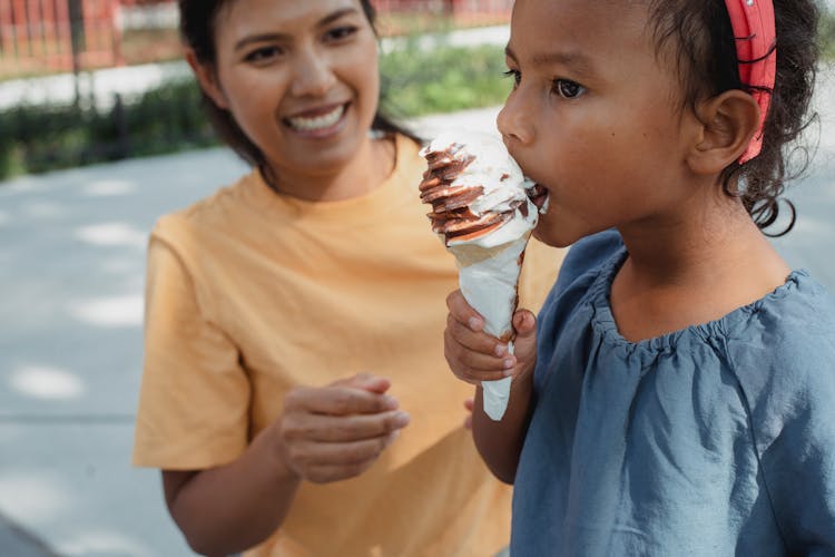 Mother With Daughter Eating Ice Cream