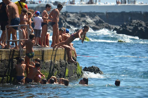 People Swimming in the Beach