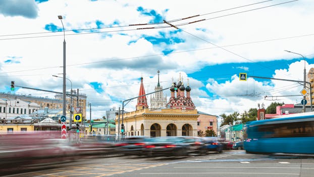Timelapse photo capturing Moscow's vibrant street life and St. Nicolas Church.