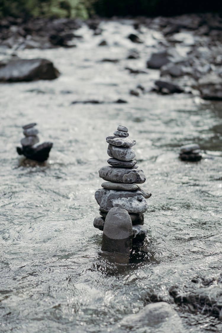 Stack Of Zen Rocks In Streaming Water Of River