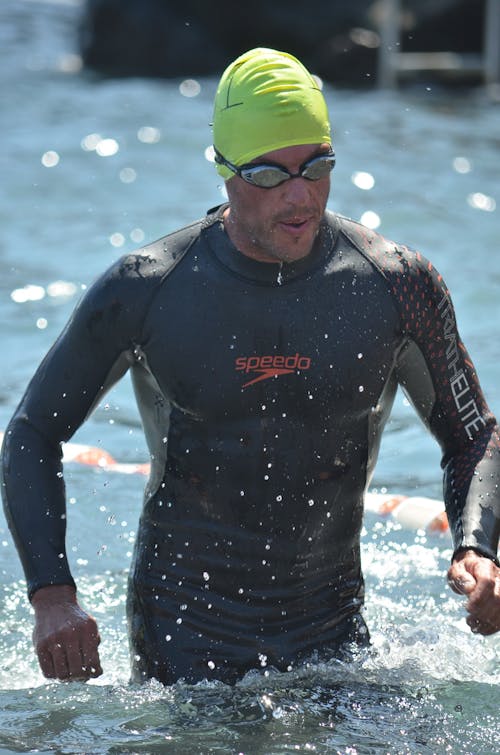 A Man in Swimwear Rising Off the Sea Water