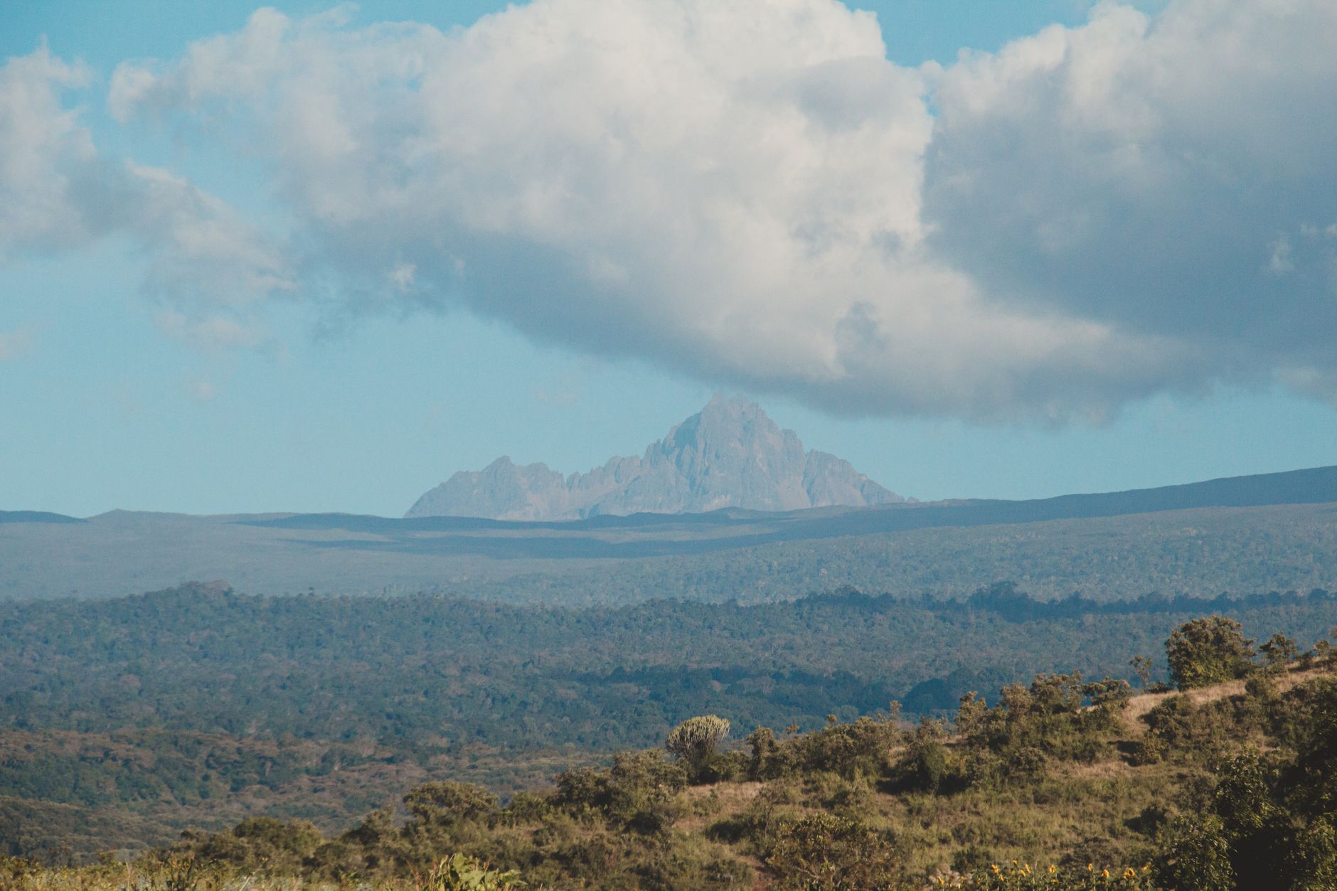 Stunning view of a mountain peak under a dramatic sky, perfect for nature and travel themes.